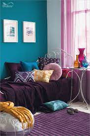 This room takes on the properties of a sophisticated woodsy retreat thanks to the bold use of orange and the weathered wood plank walls. 21 Turquoise Room Decoration Ideas Designs House Garden Diy Turquoise Room Teal Living Rooms Purple Living Room