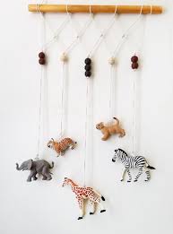 Make An Adorable Animal Wall Hanging For The Kids Room Or Nursery Turn Toy Animals Into Beautiful Play Diy Nursery Decor Boy Diy Nursery Decor Kids Wall Decor