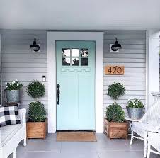 You can use all kinds of flowers that's brilliant colors such as yellow, blue, purple, red, and put them on each side of the aisle. 50 Stunning Modern Farmhouse Front Door Entrance Ideas 99decor Front Porch Remodel Porch Remodel Front Porch Decorating