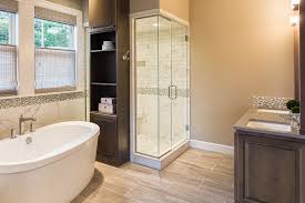 A very small bathroom with a patterned grey tile floor and a freestanding tub for a chic look. Should You Use A Freestanding Tub For Your Master Bathroom Remodel