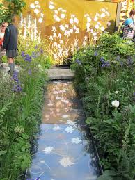 Intricate Appliqued Hollyhocks Foxgloves And Iris Panels In Huge Leather Panels By Handbag Designer Susan Garden Inspiration Garden Design Chelsea Flower Show