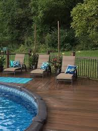 Above Ground Pool Deck Surround Composite Or Pvc Decking Is A Good Choice Over Wood Above Ground Pool Landscaping Backyard Pool Landscaping Pool Landscaping