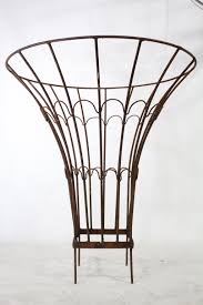 It would help support both cucumbers and squash. 25 Wrought Iron Cone Topiary Plant Support Round Trellis