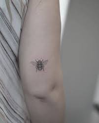 Fabulous black and white bumblebee tattoo design for pretty girl. Bumblebee Tattoo In Single Needle