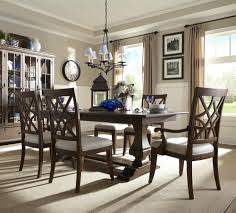 Made in the usa, it has a stainless steel trestle base with four bent, overlapping legs in a radial pattern. Trisha Yearwood Home Collection By Klaussner Trisha Yearwood Home Trestle Table With Arm And Side Chairs Set Wayside Furniture Dining 7 Or More Piece Sets