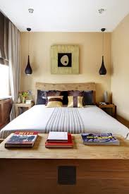 The bold wall color enhances the room making the fireplace the main feature. How To Stretch Small Bedroom Designs Home Staging Tips And Bedroom Decorating Ideas