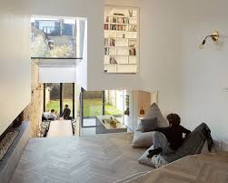 The original design provides high ceilings which make the space feel a great deal larger, though you can also cut that in half and build a second floor for even more space and storage. Split Level Homes 50 Floor Plan Examples Archdaily