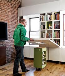 In its compact console form—which you also could use as a workspace—the table only has a depth of 15.75 inches. Space Saving Hideaway Desks For Small Apartment Designs