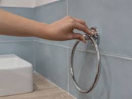 Loosen the set screws under the towel bar and remove it from the wall. How To Install A Towel Bar No Screws Required