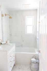 Check spelling or type a new query. 12x24 Carrera Marble Tile Kohler Brushed Gold Fixtures Kohler Bathtub Kohler 1957 La 0 Underscore White Marble Bathrooms Monochrome Bathroom Small Bathroom
