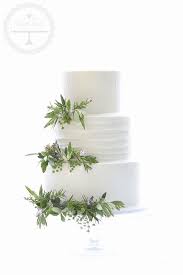 A Simple And Natural Wedding Cake Decorated With Olive Leaves And Herbs Wedding Cake Olive Leaves Wedding Cake Olive Herb Wedding