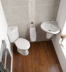 a small bathroom with a corner toilet