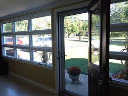 The furniture in the space is a mix of old and new, and designer furniture and custom made furniture. Window Treatments For Enclosed Front Porch