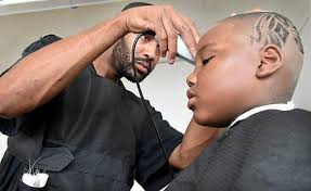 St. Paul barber offers free back-to-school kids' cuts, pandemic-style