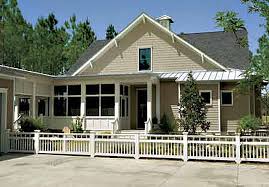 Tall columns and stacked porches give this house plan great curb appeal. Tucker Bayou St Joe Land Company Coastal Living House Plans