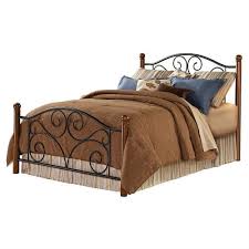 With a quality metal construction and a black finish, this bed is the perfect accent piece for your bedroom. Queen Size Black Metal Bed With Wood Post Headboard And Footboard Fastfurnishings Com