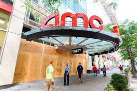 A medical worker wearing a mask walks near the amc movie theater in times square amid the coronavirus pandemic on may 7, 2020 in new york city. Amc Offers Private Theater Rentals For As Little As 99 The Verge