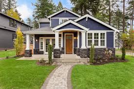 This split level exterior makeover created a refreshed, modern look for this 1970s home by carefully detailing spot alterations the façade, greatly improving its curb appeal. Interesting Exterior Remodeling Project Ideas For 2019