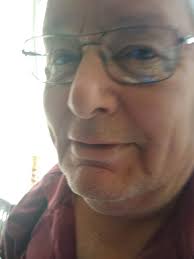 Who are the descendants of the 1929 Menominee 'Point a Minute' football  team members?