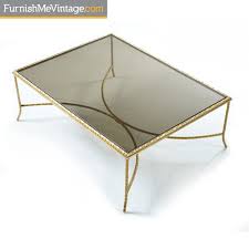 In keeping with the other elements of the collection, the ratio of the materials used is 50/50, in this case painted hdf for the cone, that appears t Brass Arch Base Gold Mediterranean Laurel Leaf Coffee Table
