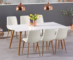 This set includes 4 sling motion chairs and an adjustable faux wood top coffee table. Malmo 180cm Matt White Table With Helsinki Faux Leather Wooden Leg Dining Chairs