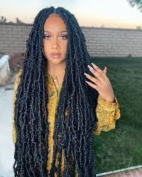 This style is achieved by using hair with a wavy texture to braid or twist your natural hair, leaving a loose piece at the end of each. Butterfly Locs Distressed Hair Faux Locs Hairstyles Hair Styles Locs Hairstyles
