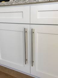 White Shaker Style Cabinets With Stainless Steel European Bar Pulls Shaker Style Kitchen Cabinets Shaker Style Kitchens Kitchen Cabinet Styles