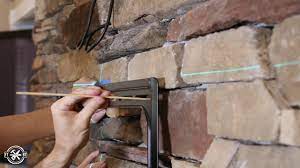 Jun 27, 2013 · as you can see in the photo above, my husband cut the stone wide enough to fit a piece of 2x4 wood, long enough for the bracket we purchased. Mounting A Tv Above A Fireplace With Full Video Tutorial Fixthisbuildthat