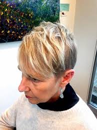 Sue's short haircut. Women's short hair should never look matronly, even if  you are a grandmother like Sue. The bright blonde looks great