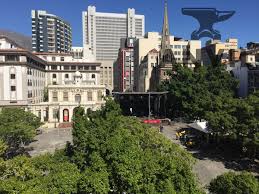 Volunteers and local residents use wet towels to fight one front of a large brush fire that started around the mountains in the city centre. Office To Let Leadership House Greenmarket Square Cape Town City Centre Cape Town Cape Town City Centre Anvil Property Smith