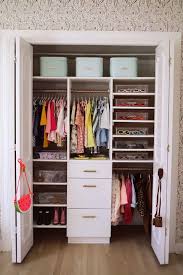Blue walk in closet features blue built in cubbies over side by side clothes rails facing a blue closet island fitted with shelves illuminated by a. 30 Best Closet Organizing Ideas How To Organize A Small Closet