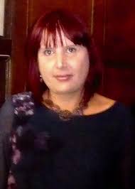 Hi all! I just wanted to introduce myself and share a photo that I took of  my daughter at my sons wedding, sadly she passed 10 years ago & it's very  dark.