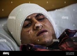 Soldier receives hi-res stock photography and images