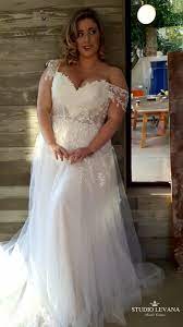 Plus Size Wedding Gown With A Sheer Corset Sparkly Tulle Skirt And Off Shoulder Sleeves Fro Plus Size Wedding Gowns Plus Wedding Dresses Wedding Dresses Lace