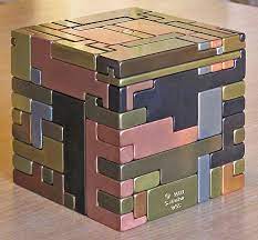Brilliant puzzles offers huge and contiguously growing variety of high quality wooden puzzles, metal puzzles, brain teaser, puzzle boxes, and wooden games, that will definitely be the center of the conversation at work or home, and will be the perfect unique and special gift to your loved ones and friends, to challenge them or yourself with these cool puzzles. 5 Sq All Metal Puzzle Pieces Must Be Slid In A Special Sequence Hidden Keys And Hidden Storage Space Idea Japanese Puzzle Metal Puzzles Japanese Puzzle Box