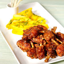 Mbah cemplung restaurant serves a menu of fried chicken as its mainstay. Sayap Ayam Goreng Thai Dengan Saus Panas Dan Asam Dan Mangga Asin