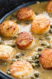 Golden Brown Scallops Sitting In A Lemon Caper Sauce Scallop Recipes Seafood Recipes Recipes