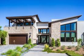 We have a zinc roof, colourbond wallaby gutter with white (pearl white) aluminium fascia and windows. Cut Coarse Stone Eldorado Stone