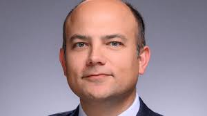 Brandon E. Roach appointed vice president and Robert K. Johnson General  Counsel