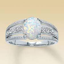 Opal Wedding Ring I M Kind Of Liking That It S Unique Not Sure If I Want To Replace The Diamond Jus Opal Wedding Rings Opal Wedding Band Wedding Ring Bands