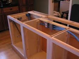 A counter extension adds storage space to this remodeled kitchen. 10k Kitchen Remodel Kitchen Island Installation In Progress How To Install Kitchen Island Kitchen Island Cabinets Building A Kitchen