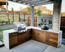 The Outdoor Kitchen Is Finally Complete Our Contractor Did A Great Job Integrating The We Outdoor Kitchen Design Outdoor Kitchen Outdoor Kitchen Design Layout