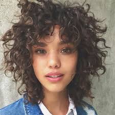 This choppy pixie for curly hair is adorable! 25 Photos That Will Make You Want Curly Bangs Short Curly Haircuts Haircuts For Curly Hair Curly Hair Styles Naturally