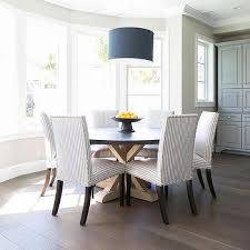 This dining table is a perfect pick for a patio, rooftop, or balcony that is lacking in square footage. Ivory Kitchen Cabinets Transitional Kitchen Elissa Grayer Design