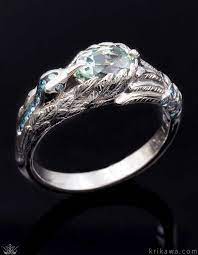 Hummingbird Engagement Ring With An Oval Sapphire Center Stone And Blue Diamond Accents Make This Desi Engagement Rings Intricate Engagement Ring Luxury Rings
