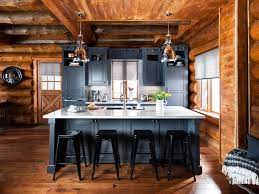 This rustic kitchen with a modern twist leads to an outdoor kitchen with a nanawall system. Before And After A Rustic Log Cabin Log Cabin Kitchens Log Home Kitchens Cabin Kitchens