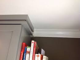 Though cutting it may seem like a daunting place the inside edge of your bevel's tightening nut on the corner of your cabinet. Corner Blynth Stop Where Crown Molding Meets Trim Detail Above Cabinets Menlo Park Ca Crown Molding Above Cabinets Cabinet