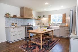 I especially love the unique farmhouse decor idea above the island and rustic touch to the kitchen hood. How To Decorate Like Joanna Gaines House Home