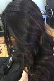 This Model S Wavy Dark Brown Hair Is Ever So Lightly Highlighted With Some Subtle Light Brown Highlights Black Hair Balayage Hair Highlights Light Brown Hair