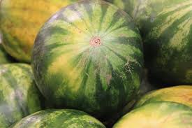 Watermelons piled high at your grocer for the picking. How To Pick The Perfect Watermelon